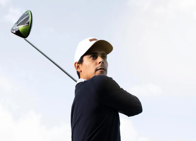 Golfer teeing off on the golf course during a round